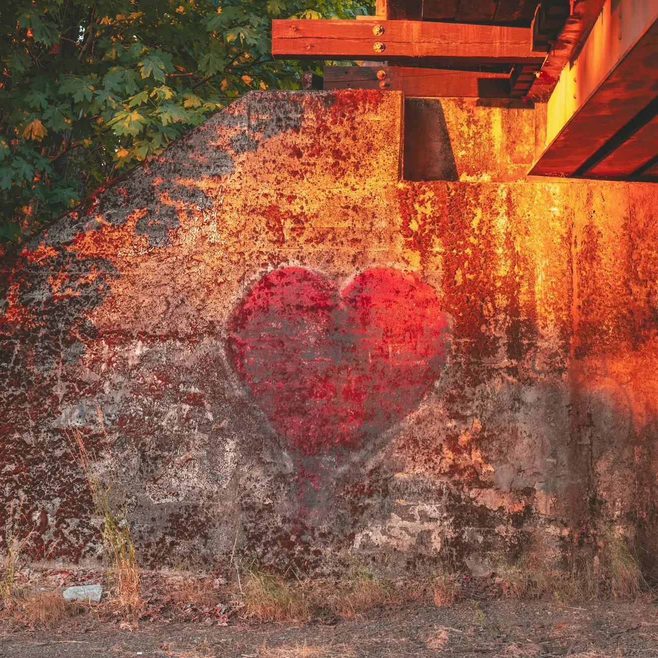 A heart painted on the side of a building.