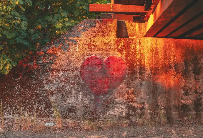 A heart painted on the side of a building.